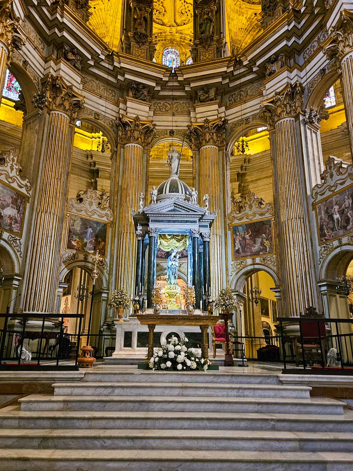 View to the altar and some of the decoration and columns of Malaga cathedral - one of the many places to visit in Malaga with kids