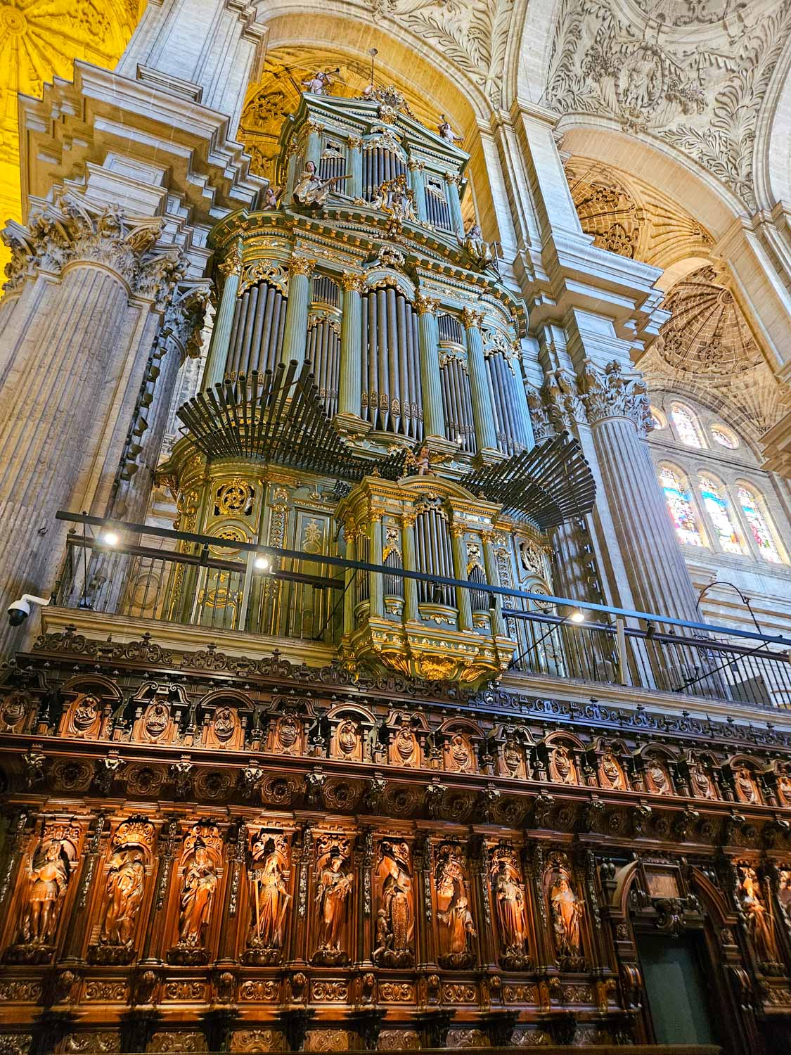 One of the twin organs in Malaga cathedral with the carvings of the choir stalls underneath - a visit is one of the great things to do in Malaga with kids