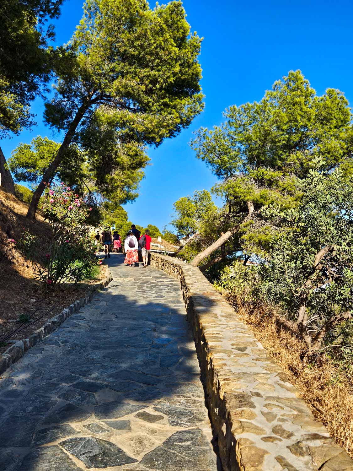 View of the steep path up to Gibralfaro Castle in Malaga - a visit is one of the best things to do in Malaga with kids