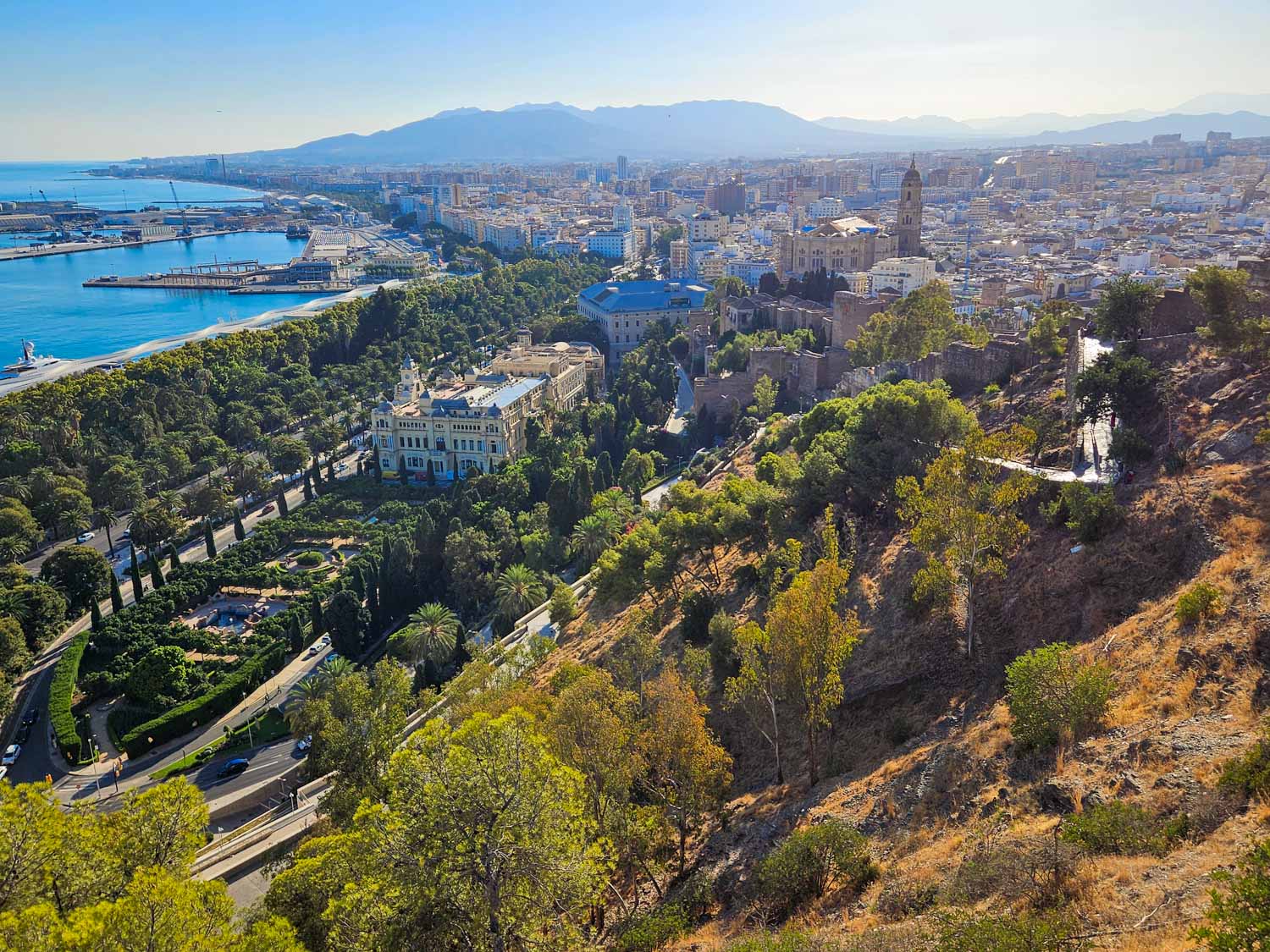 View from the castle down onto the park and buildings of Malaga - my tips on the best things to do in Malaga with kids