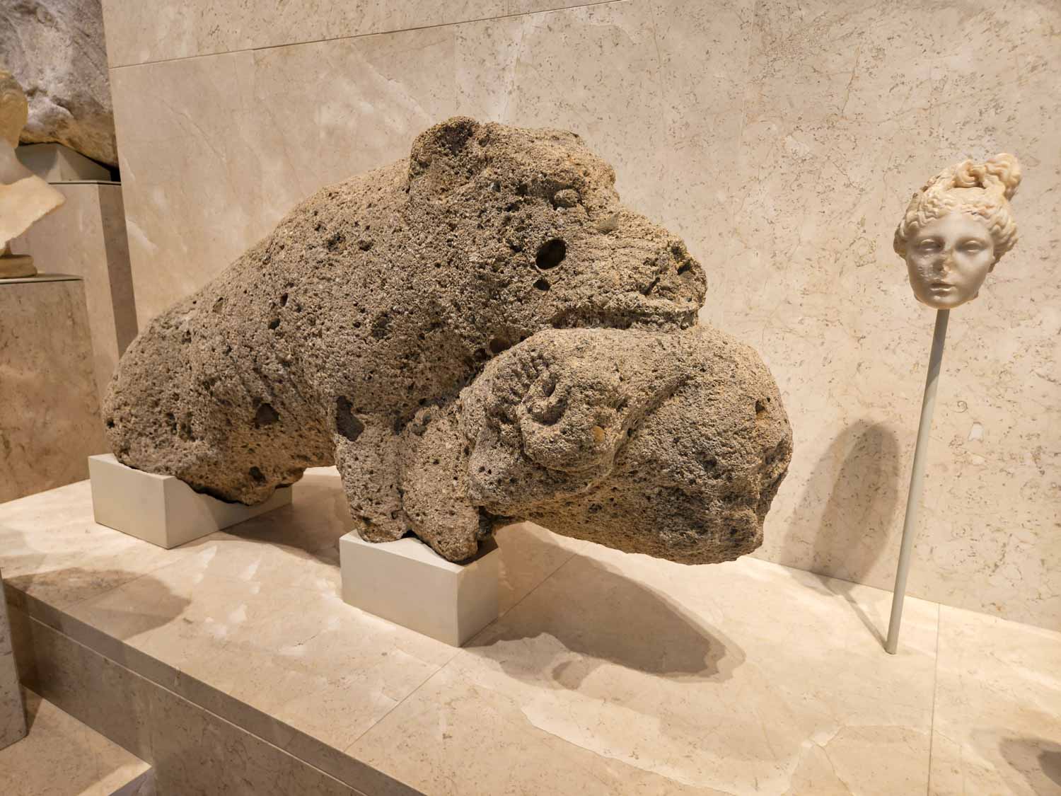 Roman stone sculpture of a bear eating a ram at the Museum of Malaga - one of the artefacts to look out for on a visit to Malaga with kids