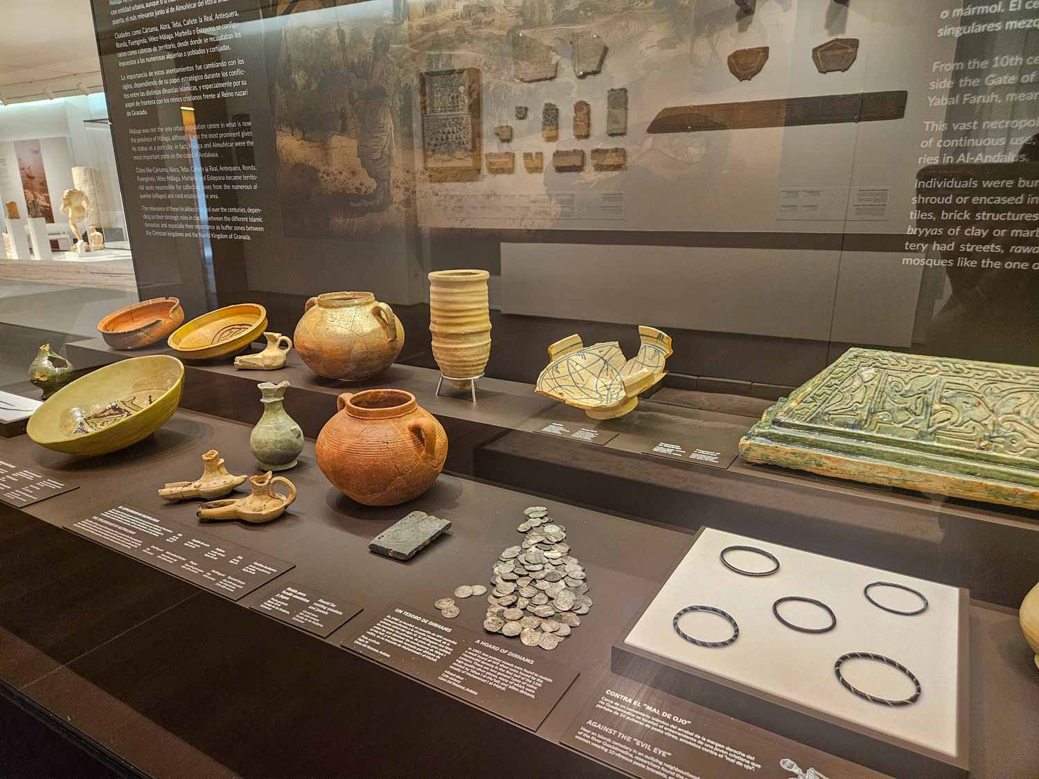 Coins, pottery and other artefacts on display in the Museum of Malaga - one of the historic places to visit in Malaga with kids