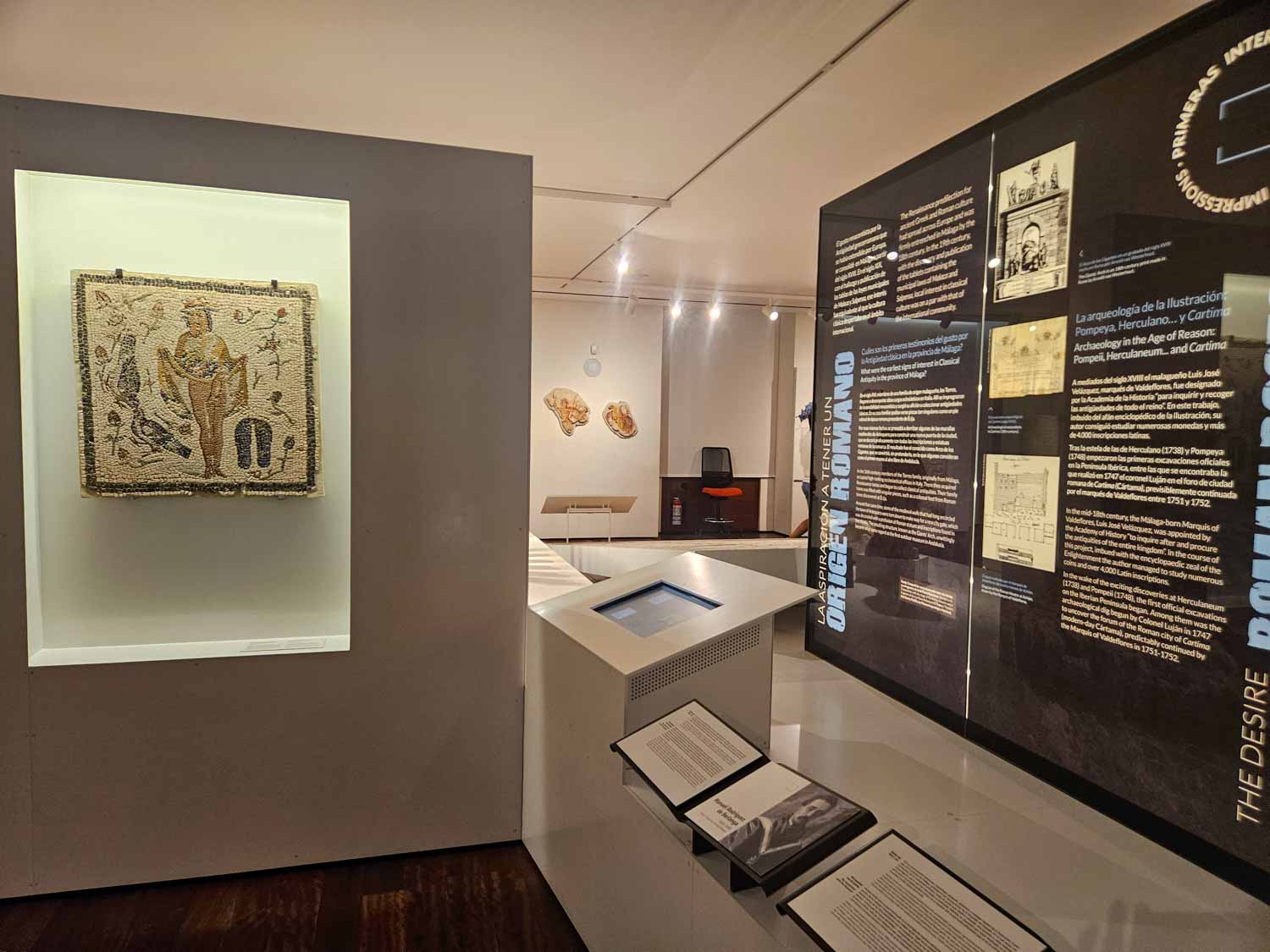 Displays in the Roman section of the Museum of Malaga including a mosaic - one of the historic place to visit in Malaga with kids