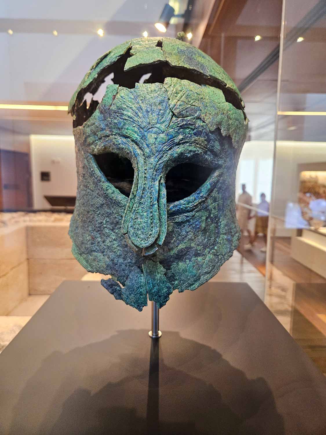 Bronze Greek helmet unearthed in a 6th century BCE grave at the Museum of Malaga - one of the items to look out for during a visit to Malaga with kids