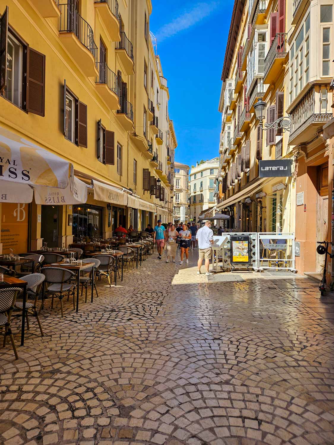 View down a cobbled side street in the old town of Malaga - a walking tour is one of the great things to do in Malaga with kids